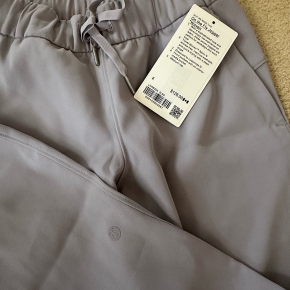 LULULEMON - Size 4 On The Fly Jogger 28" Woven NWT - Dark Chrome - Picture 3 of 4